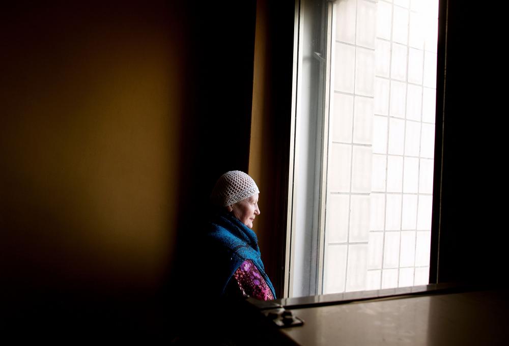 This peaceful portrait was taken, by Paolo Pellegrin, in an oncological dispensary in St. Petersburg, Russia in 2005. This lady "recovered from a remission from stage 4 lymphosarcoma after six cycles of chemotherapy"